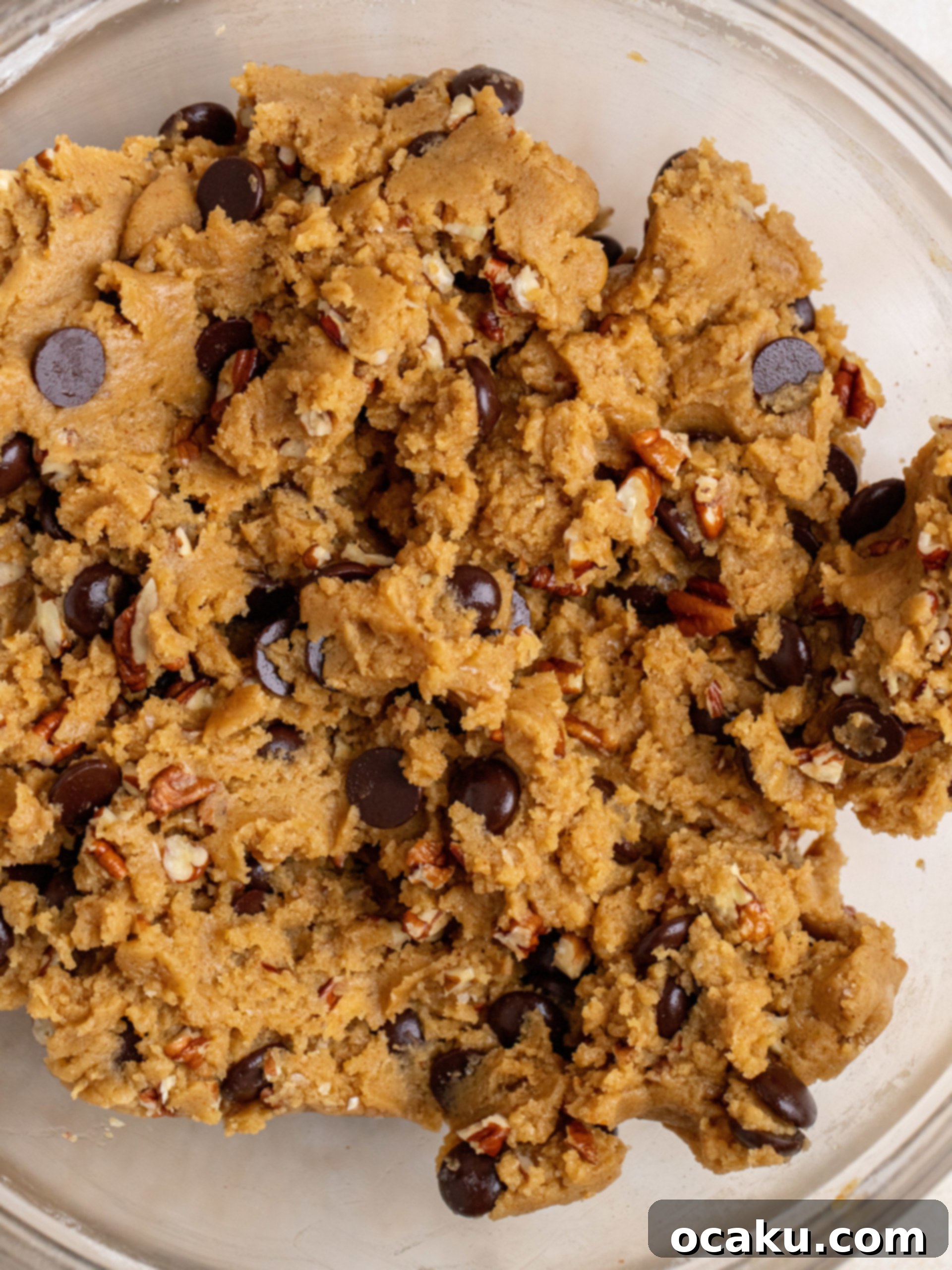 Decadent Chocolate Pecan Cookies 6 Folding in chocolate chips and chopped pecans into the cookie dough.