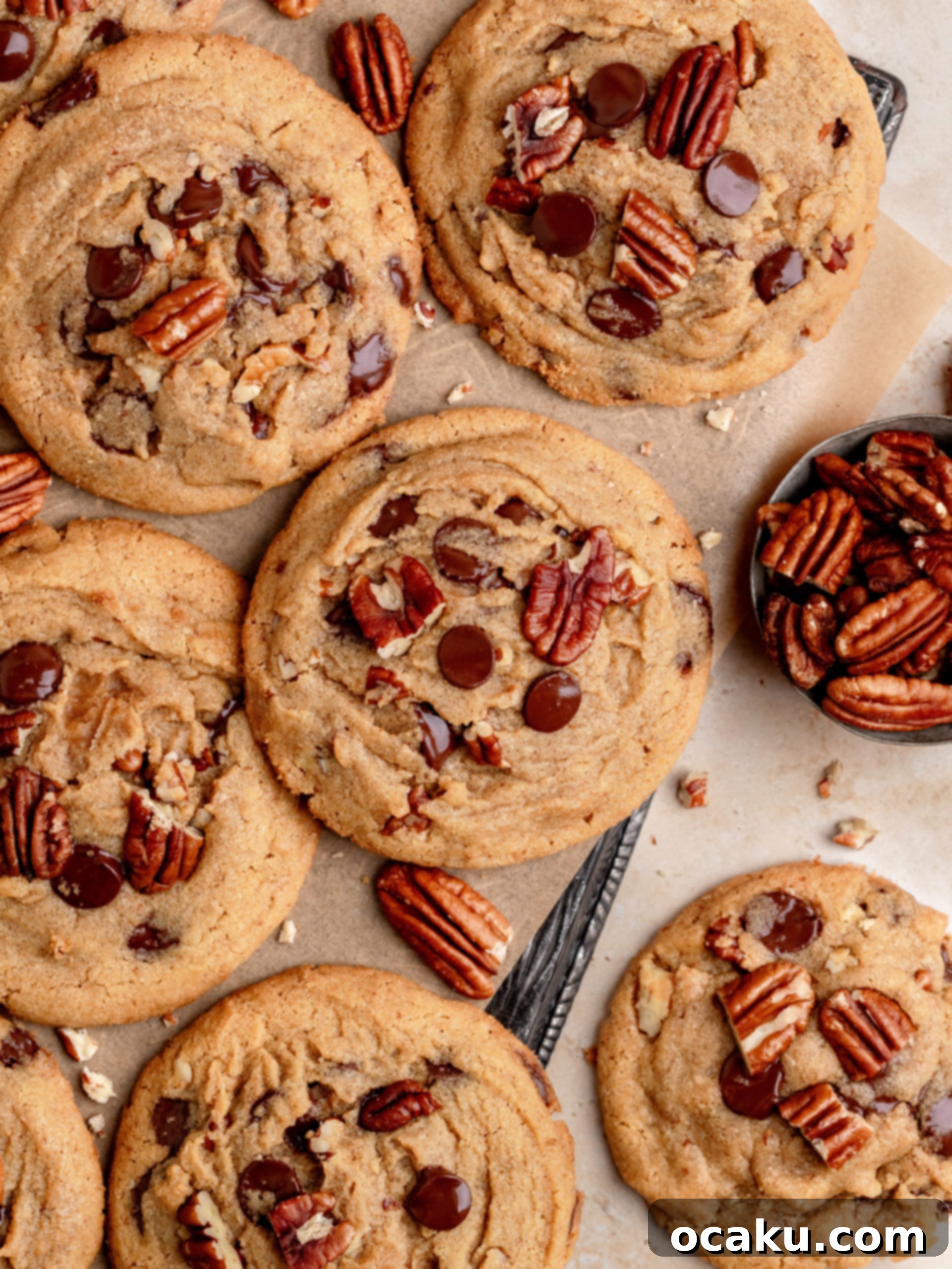 Decadent Chocolate Pecan Cookies 8 Freshly baked chocolate chip pecan cookies cooling on a wire rack.