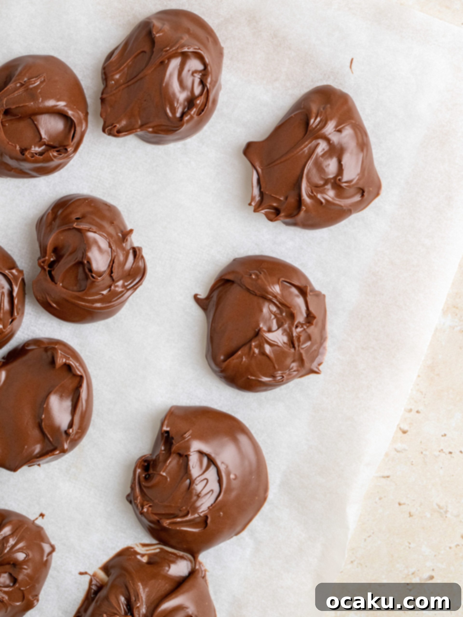 Wet ingredients (melted butter, sugars, egg) being whisked together in a large bowl, showing a smooth, light brown mixture.