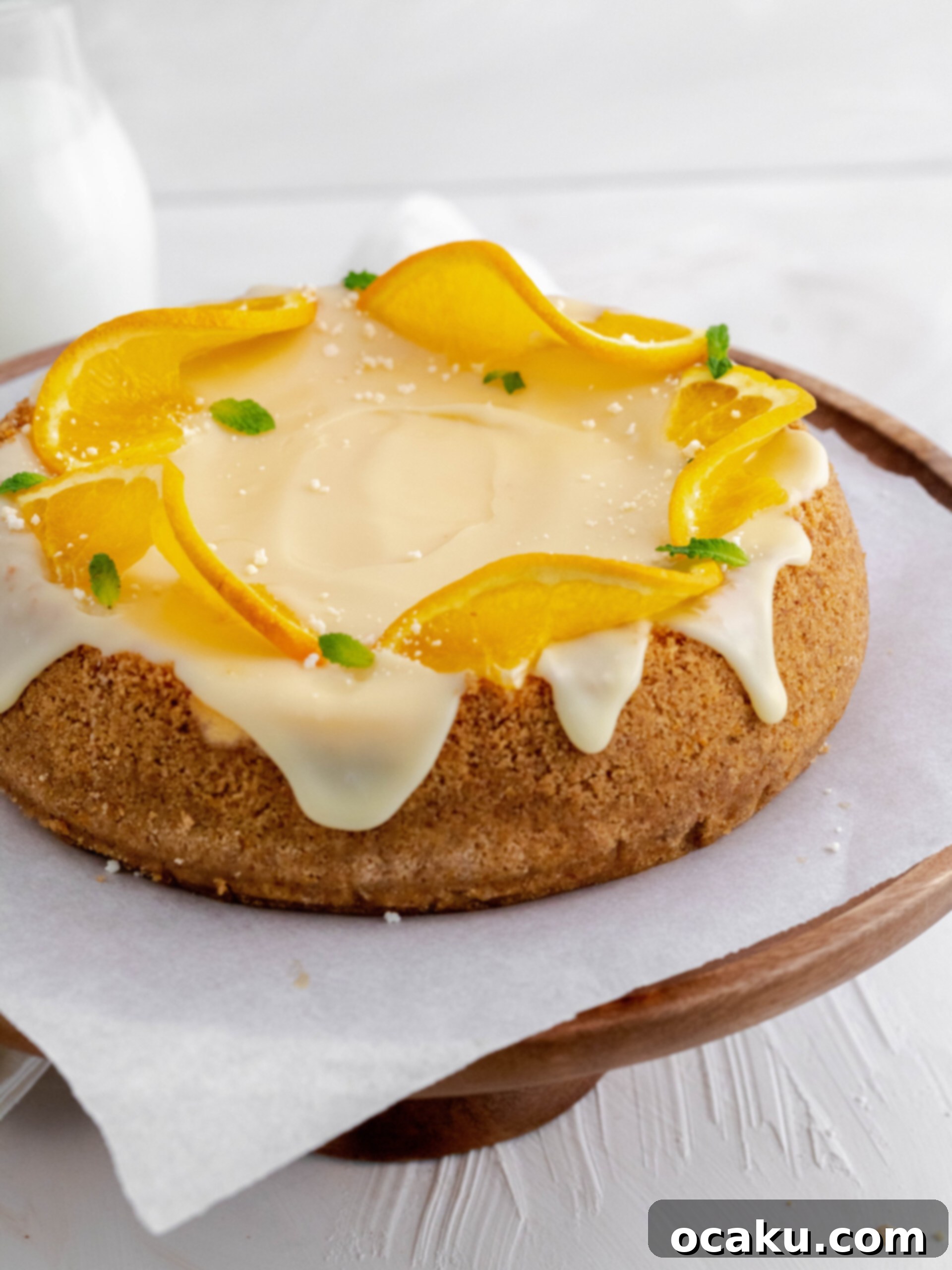 Aperol Spritz Cheesecake Close-up of a slice of Aperol Spritz Cheesecake revealing its creamy texture and orange crust.