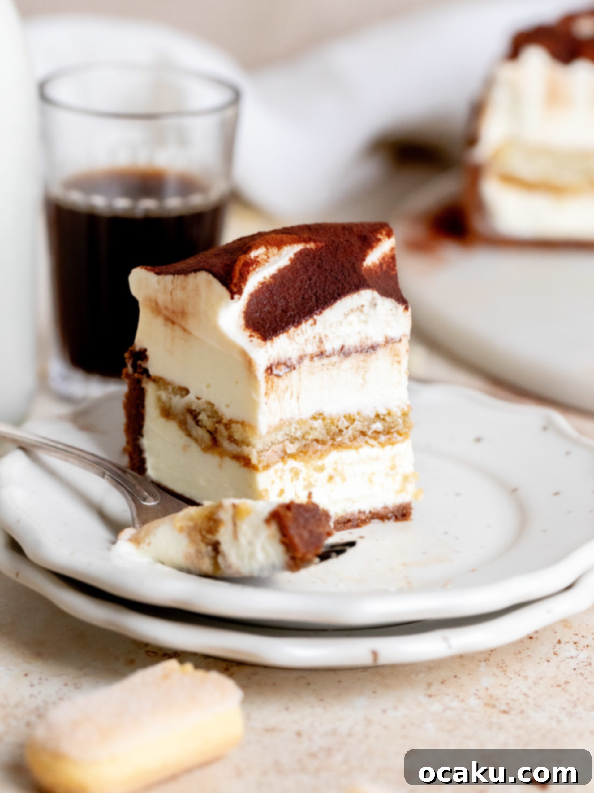 Tiramisu Cheesecake Indulgence 9 Whole Tiramisu Cheesecake on a stand, ready to be served.