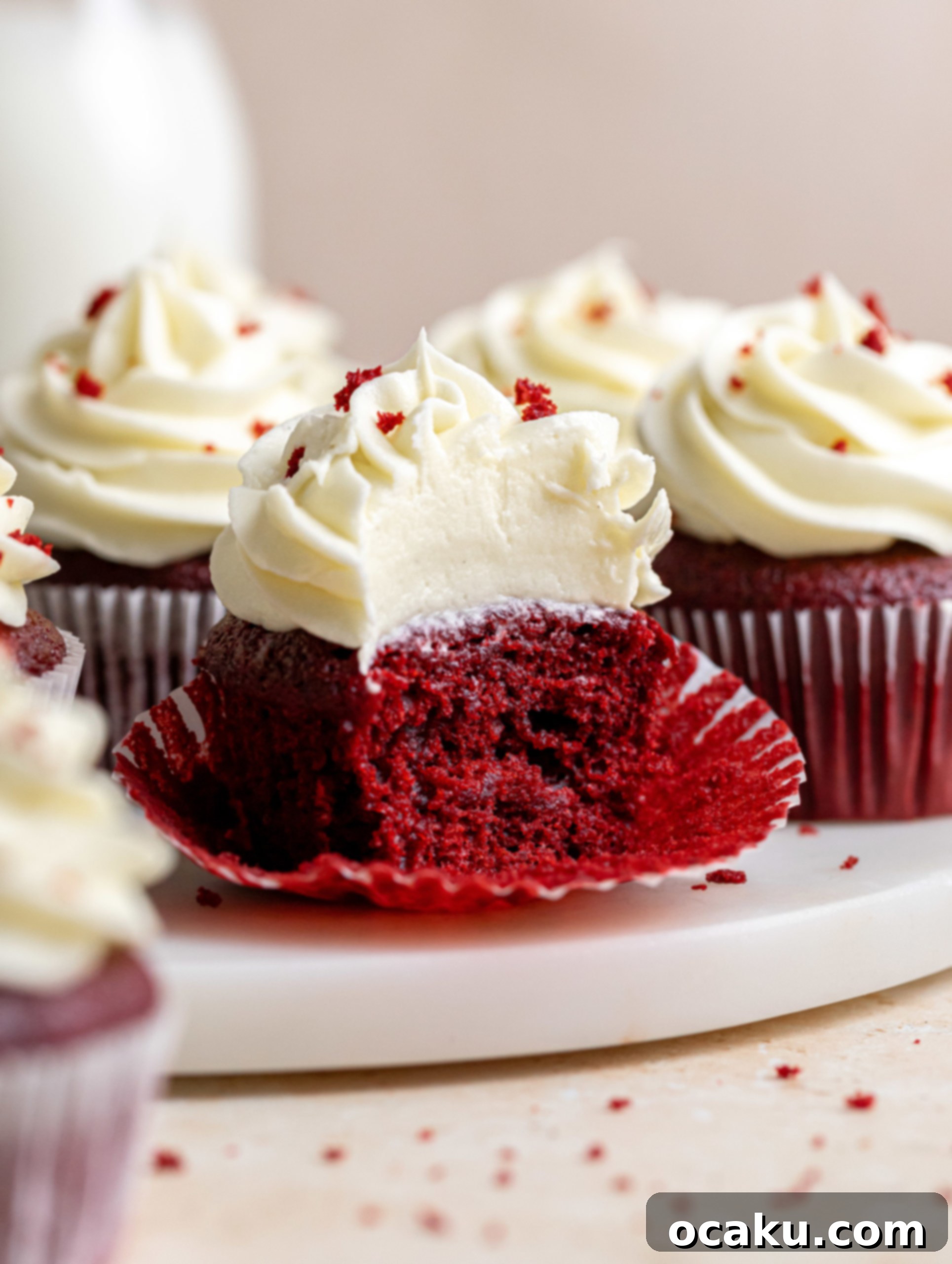 Several red velvet cupcakes beautifully arranged and frosted