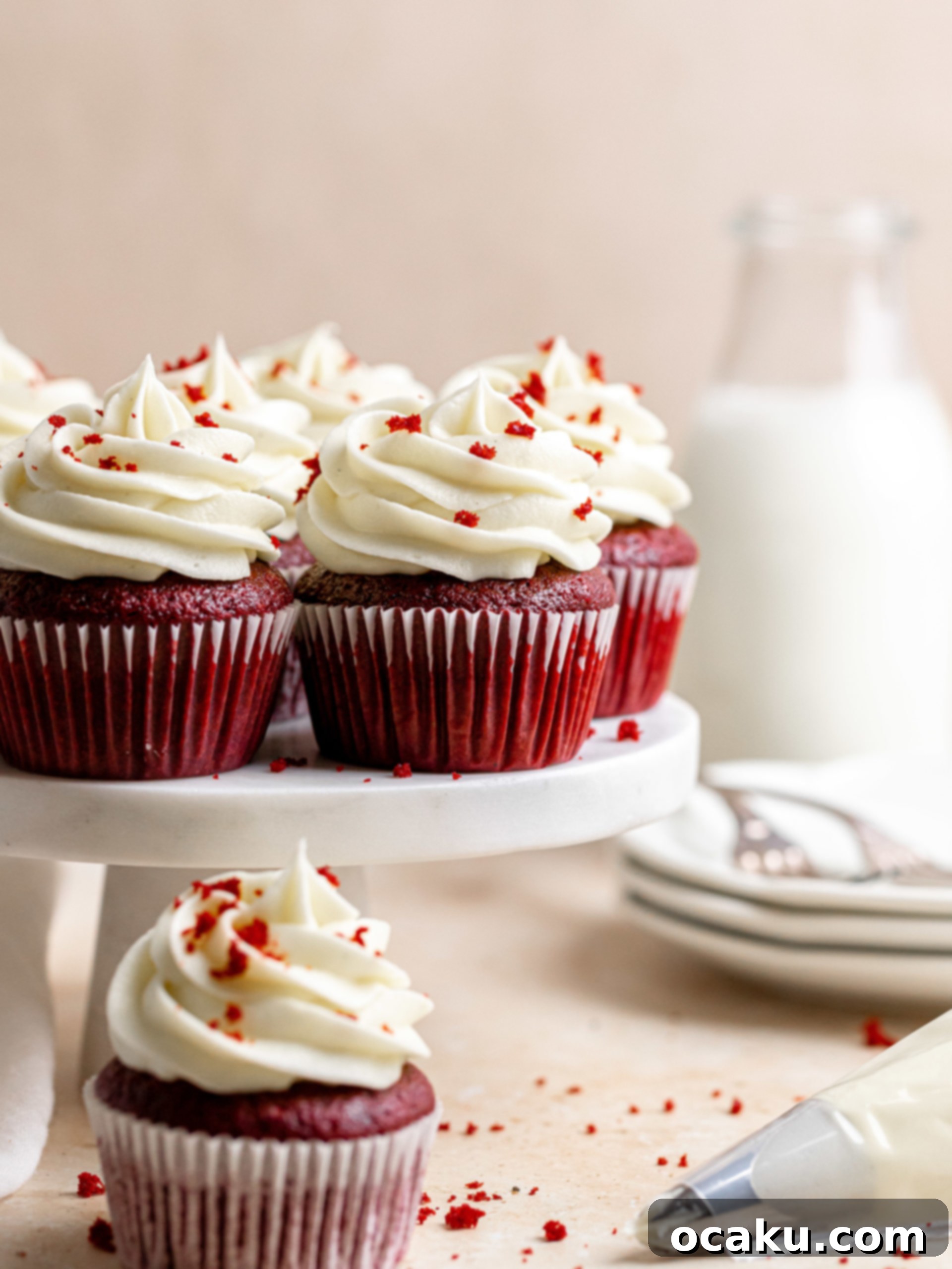 Close-up of a beautifully piped red velvet cupcake with cream cheese frosting