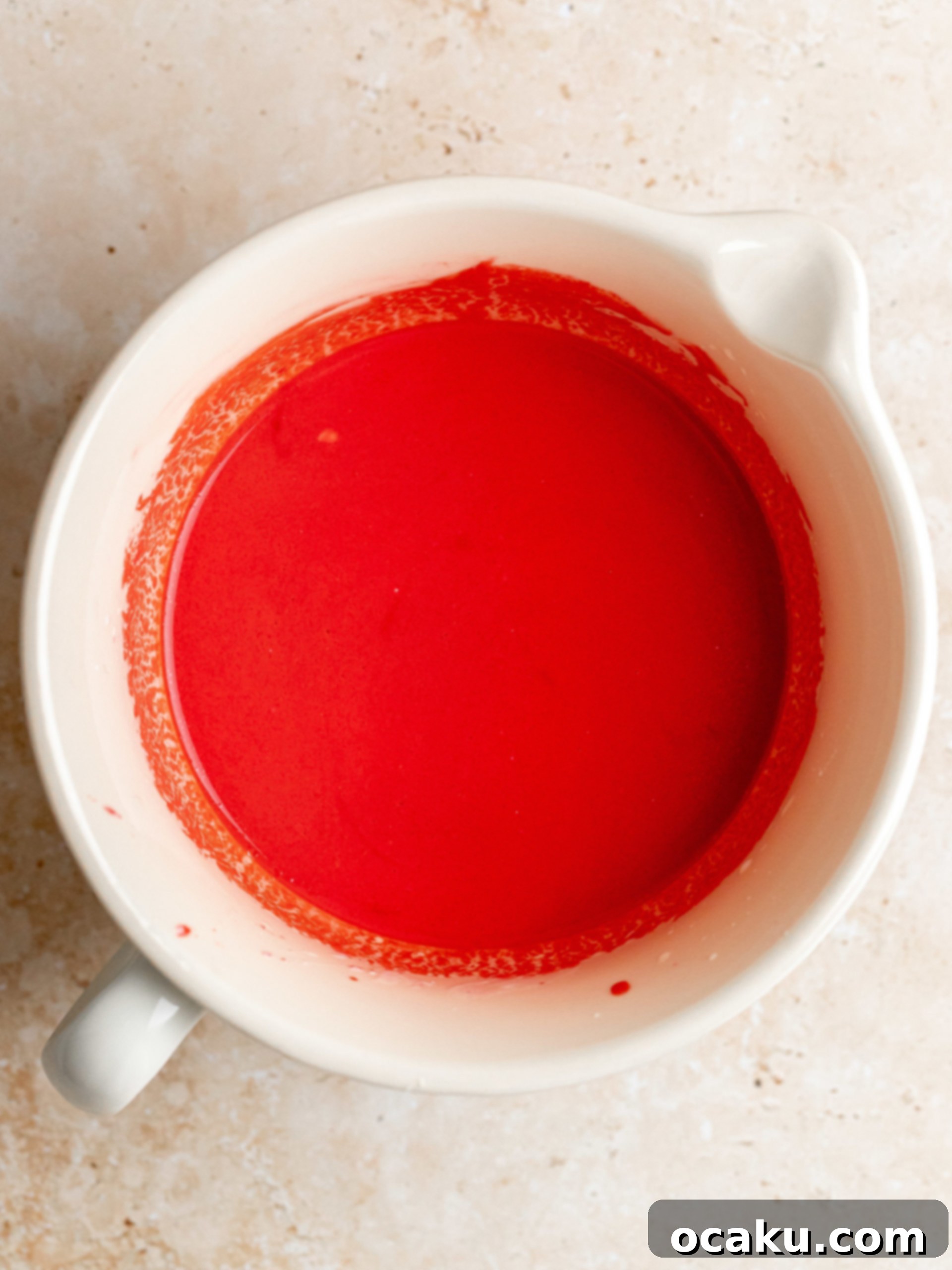 Wet ingredients for red velvet cupcakes in a bowl